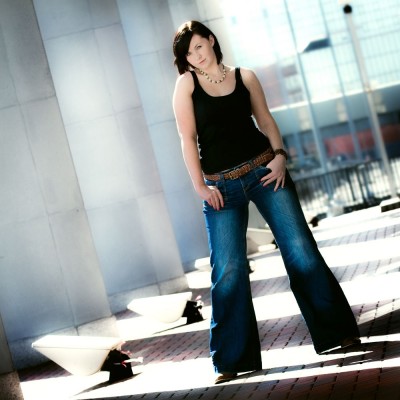 Here I liked the way the row of concrete pillars on the left allowed light and shadow to fall across the paving abd create depth in the image. Lora's wide stance gave this an urban fashion look.